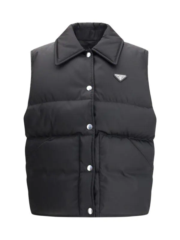 Lux Brands black puffer vest with side pockets and brand logo, versatile outerwear for a stylish and cozy look. perfect for layering in colder weather. lightweight and warm.