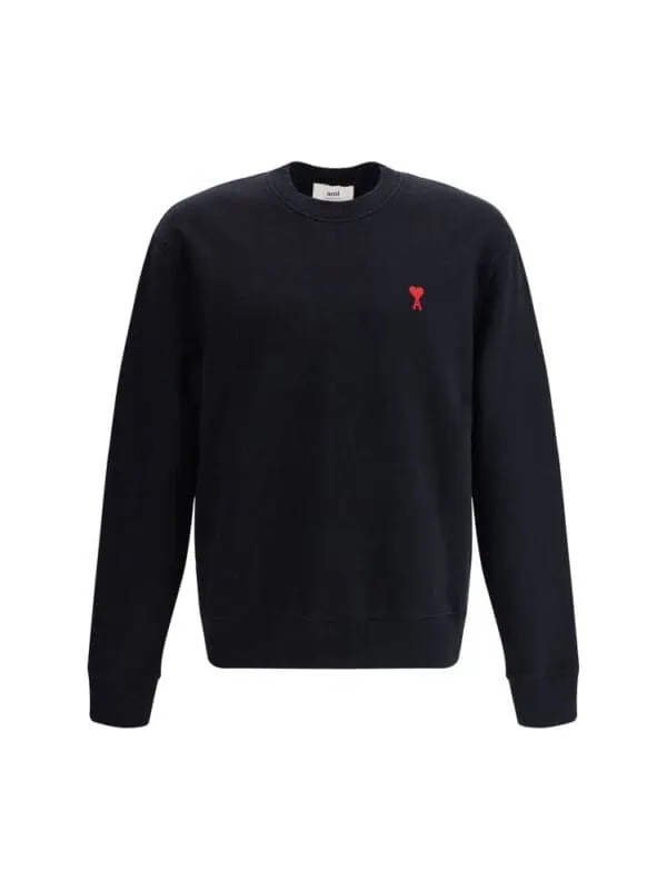 Black crewneck sweatshirt with a small red embroidered logo on the chest, perfect for casual and stylish everyday wear.