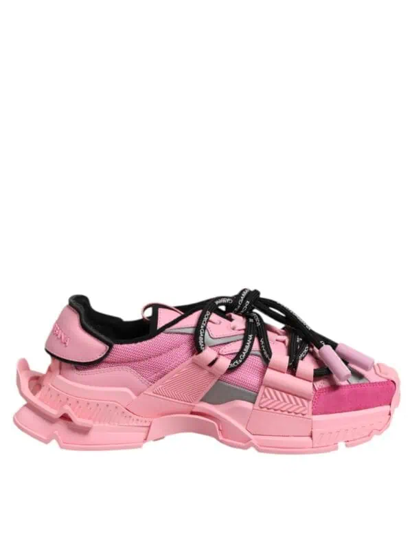 Bold pink luxury sneakers with chunky sole and intricate design details, blending fashion and comfort for statement footwear.
