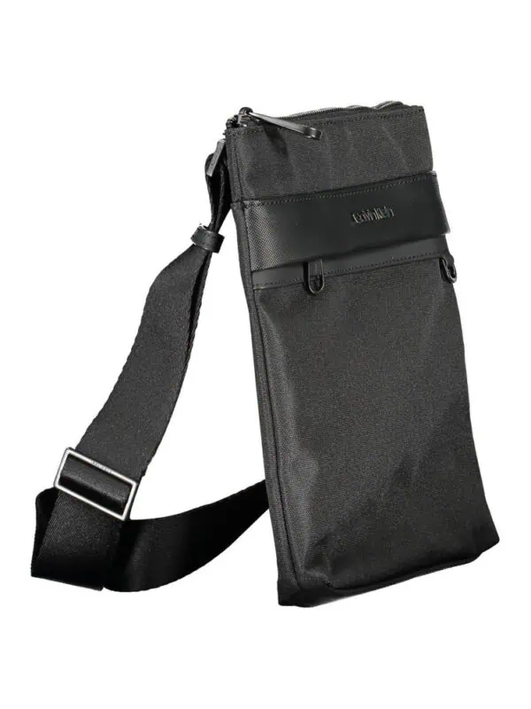 Black crossbody bag made of durable fabric with multiple compartments and adjustable strap, perfect for everyday use and travel.