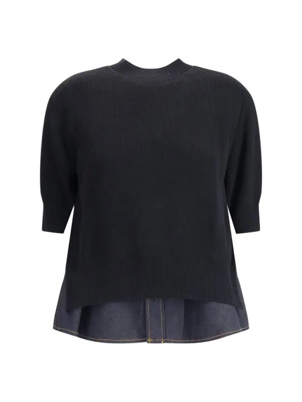 Cotton black oversized sweater layered over a dark denim shirt for a stylish, comfortable look. Crafted with high-quality materials, perfect for casual or semi-formal occasions.