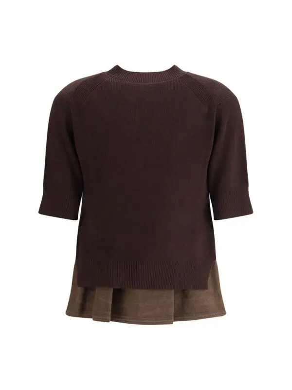 Brown oversized sweater layered over a brown skirt, stylish and comfortable, perfect for casual and chic outfits.