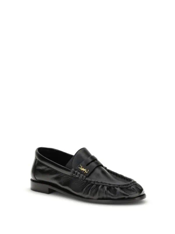 Lux black leather loafer with gold logo accent, stylish and sophisticated men's footwear for formal or casual occasions. Perfect for elevating your wardrobe with luxury and comfort.