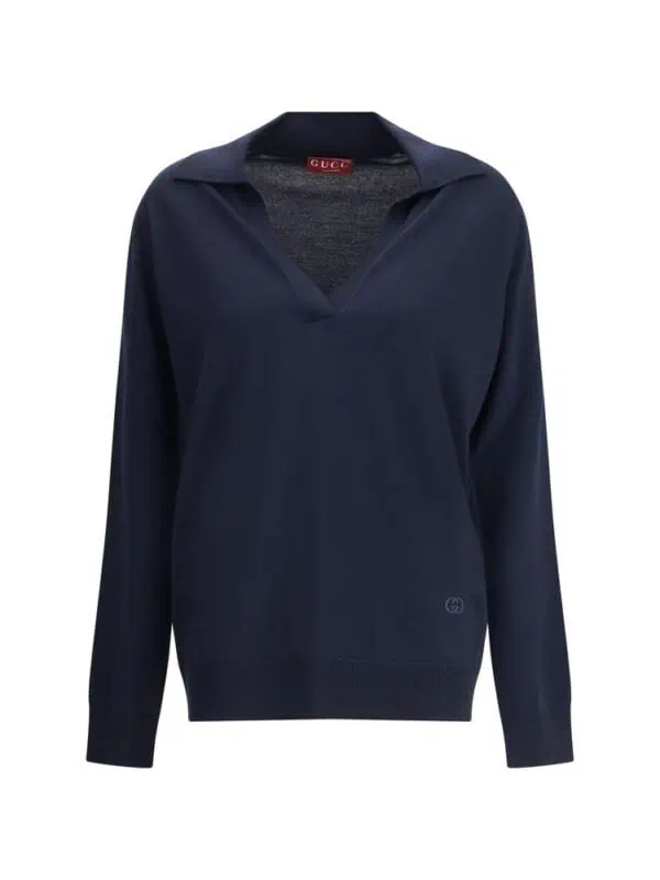 Lux Gucci navy blue oversized V-neck sweater with relaxed fit and classic branding, ideal for stylish casual wear. | Lux Gucci navy blue oversized V-neck sweater featuring a relaxed fit and subtle branding, perfect for fashionable casual looks. | This luxurious Gucci navy blue sweater showcases a relaxed oversized fit with a V-neck design, crafted from high-quality materials for comfort and style. Perfect for elevating your casual wardrobe with a touch of designer sophistication. | Relevance: Yes.
