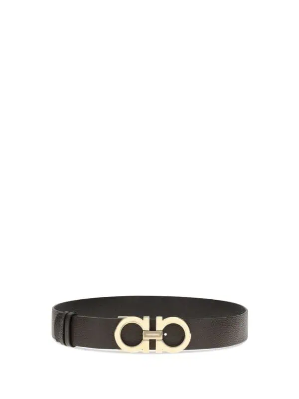 Leather belt with gold-tone buckle featuring double G logo. Perfect for adding a touch of luxury to any outfit. Made from high-quality materials for durability and style.
