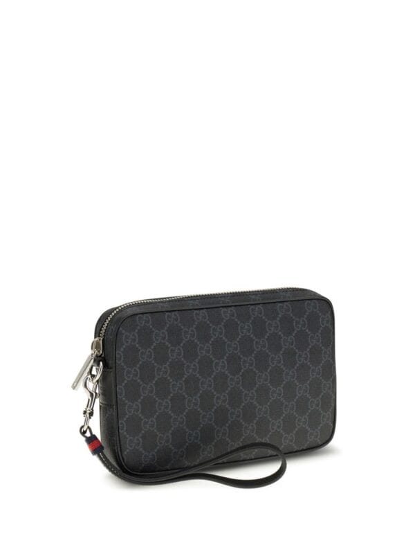 Gucci GG Supreme leather wristlet clutch with metal zipper closure and wrist strap, perfect for stylish everyday use.