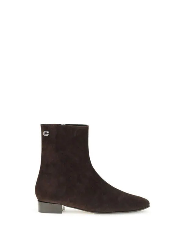 Stylish dark brown suede ankle boot with silver hardware accent and a low block heel, perfect for fall and winter fashion.