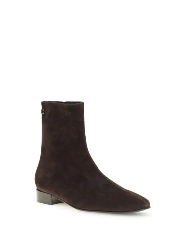 Brown suede pointed-toe ankle boot with a low block heel for a chic and sophisticated look. Perfect for fall and winter fashion statements. Elegant design by Lux Brands.