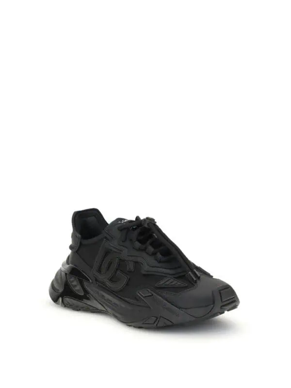 Black modern luxury sneaker with intricate design details for stylish comfort.