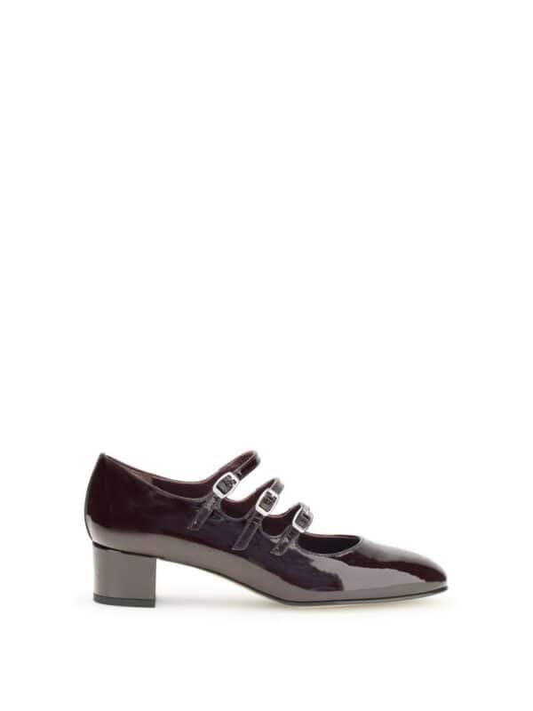 Elegant burgundy patent leather block heel with triple buckle straps, perfect for chic office wear or stylish outings.