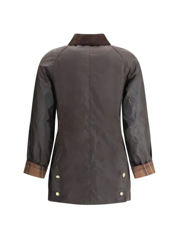 Classic women's trench coat with plaid lining and button details, perfect for stylish outerwear.