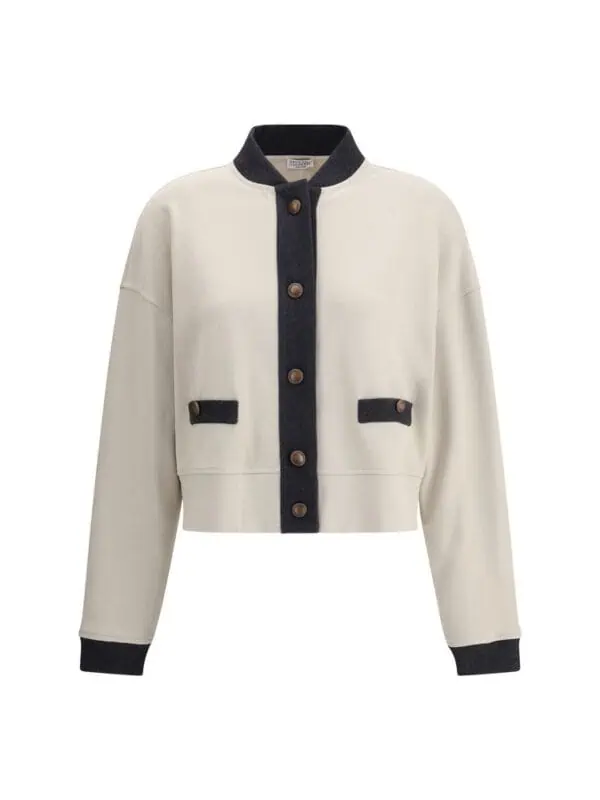 Cream and black varsity style women's jacket with large front buttons and patch pockets, perfect for casual and chic fashion statements.