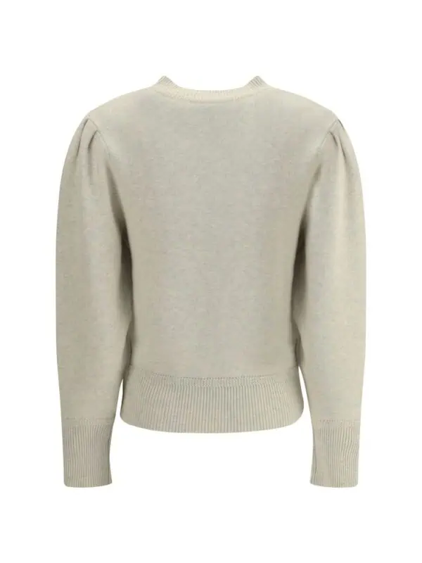 Cream-colored women's crewneck sweater with puffed long sleeves and ribbed cuffs and hem, made from soft, high-quality fabric for a luxurious feel.