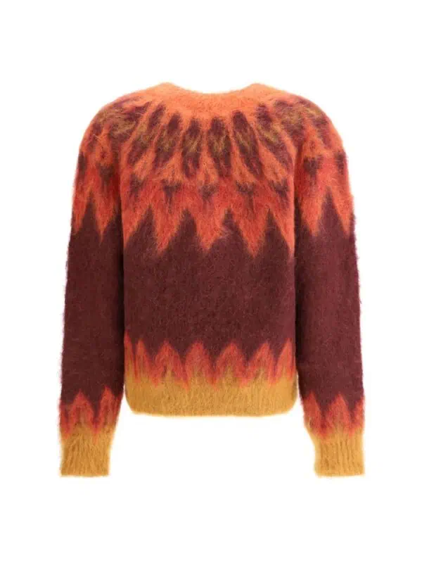 Vivid fiery-colored patterned sweater made from soft, fuzzy material with a bold flame-like design in red, orange, and yellow shades for a stylish and cozy look.