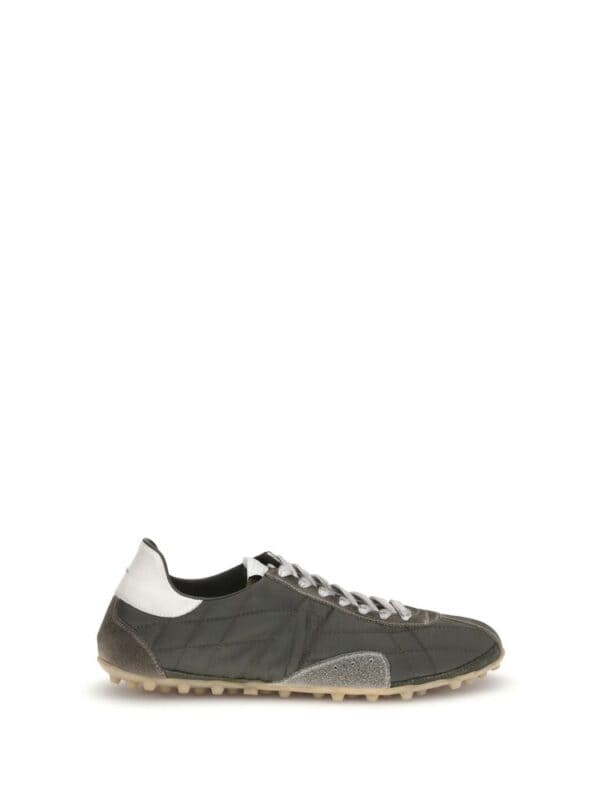 Men’s designer sneakers in black, white, and grey with a casual yet luxurious style, perfect for everyday wear and fashion-forward looks.
