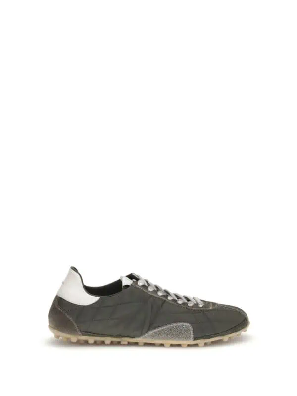 Men’s designer sneakers in black, white, and grey with a casual yet luxurious style, perfect for everyday wear and fashion-forward looks.