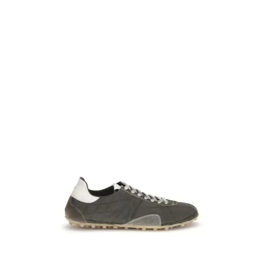 Men’s designer sneakers in black, white, and grey with a casual yet luxurious style, perfect for everyday wear and fashion-forward looks.