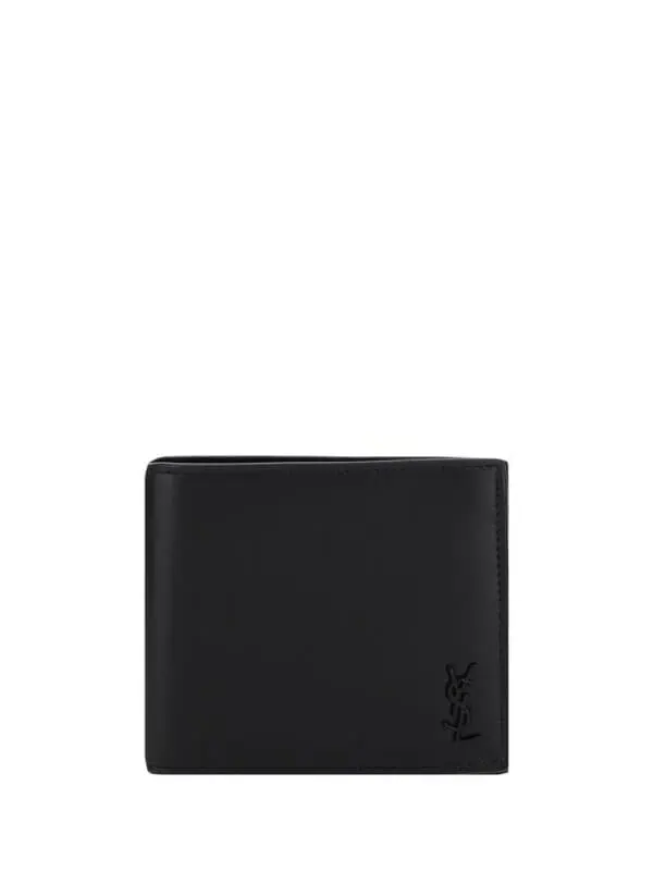 Black Yves Saint Laurent men's wallet made from high-quality leather with embossed logo. Perfect for luxury fashion enthusiasts and everyday use.