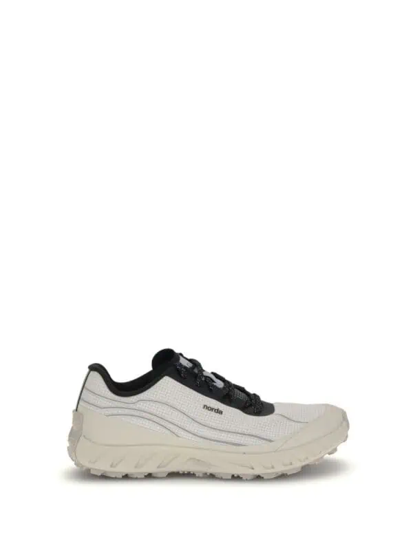 Comfortable white and black Norda trail running shoe with durable sole and sleek design for outdoor activities. Perfect for athletes seeking stylish performance and support on rugged terrain.