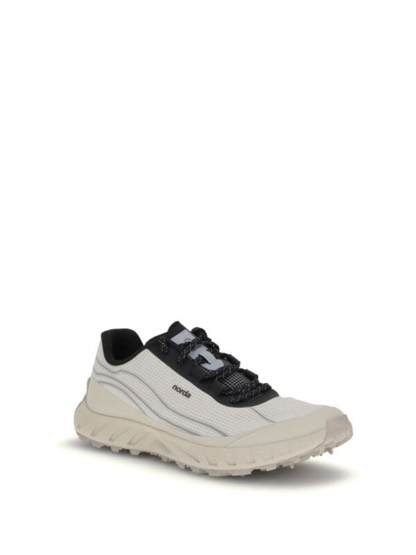 Nordic outdoor running shoe in white and black with cushioned sole for trail walking and hiking.