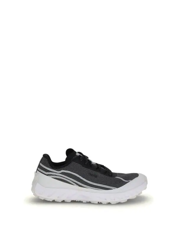 Black and white running shoes with mesh upper and thick cushioned sole for athletic performance and comfort. Ideal for running, walking, or casual wear with a modern sporty design.