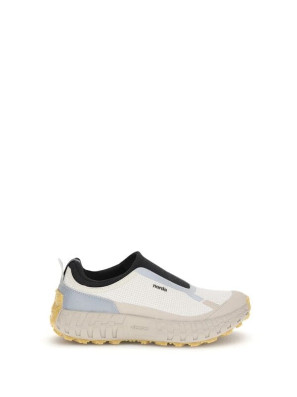 Lightweight waterproof sneaker with slip-on design and rugged sole for outdoor activities.