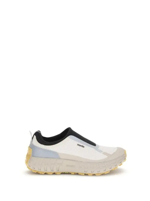 Lightweight waterproof sneaker with slip-on design and rugged sole for outdoor activities.