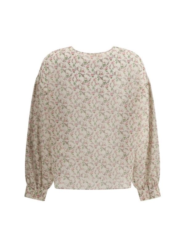 Vintage floral print blouse with long sleeves and a relaxed fit, perfect for casual or elegant occasions. Crafted from lightweight fabric with delicate pink and green floral patterns.
