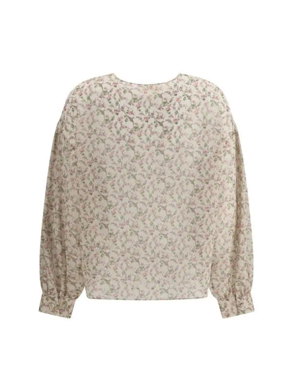 Vintage floral print blouse with long sleeves and a relaxed fit, perfect for casual or elegant occasions. Crafted from lightweight fabric with delicate pink and green floral patterns.