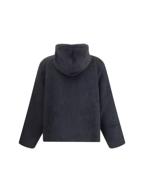 Soft black faux fur hooded jacket for stylish winter wear. Cozy and luxurious design perfect for cold weather, offering comfort and warmth with a contemporary look. Ideal for fashionable winter outfits.