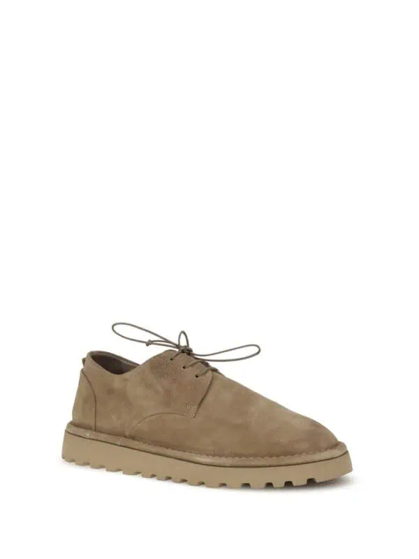 Beige men's suede casual lace-up shoe with chunky sole, stylish and comfortable for everyday wear. Perfect for fashion-forward men seeking luxury footwear.