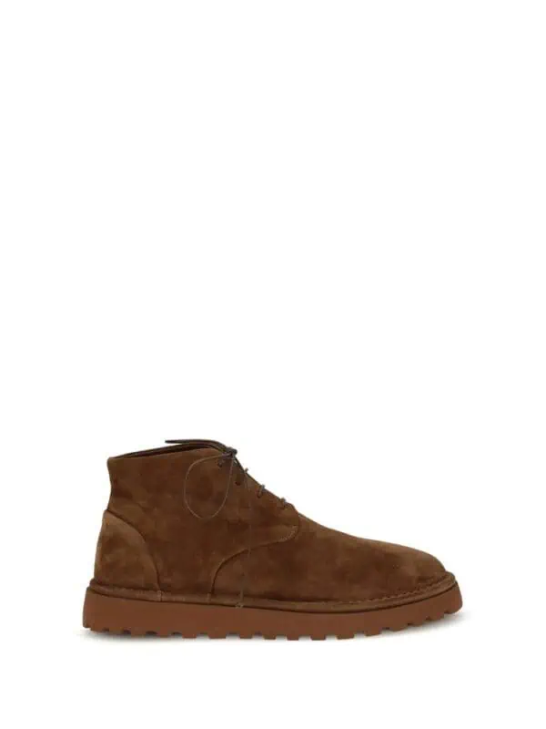 Suede brown ankle boot with rugged sole for stylish comfort and durability. Perfect for casual or outdoor wear, combining classic design with modern functionality. High-quality craftsmanship from Lux Brands.