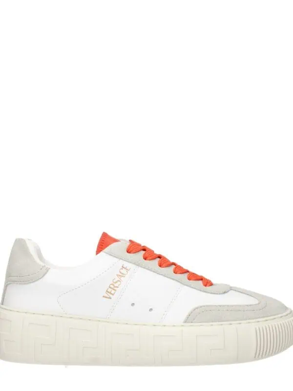Lux Brands white and beige sneakers with orange accents and a Greek key patterned sole. High-quality designer footwear for casual and luxury fashion styles. Perfect for upscale streetwear looks.