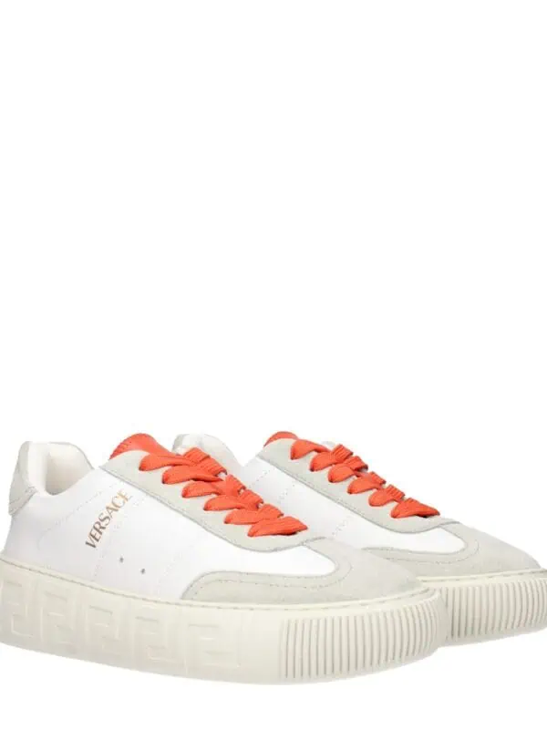 Versace white sneakers with orange laces, stylish and luxurious footwear for men or women.