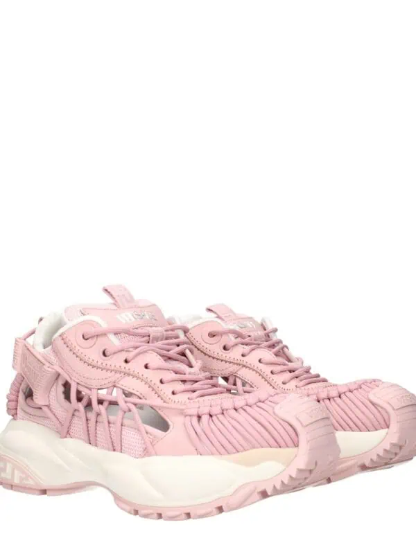 Pink Versace Chain Reaction sneakers with a chunky sole and intricate design details for a luxurious and trendy look.