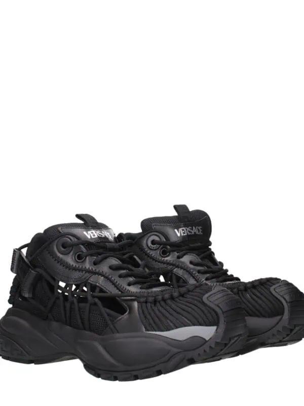 Black Versace sneakers with intricate design, durable sole, and luxury branding. Perfect for high-end streetwear and fashion-forward outfits. Elevate your style with these designer sneakers.