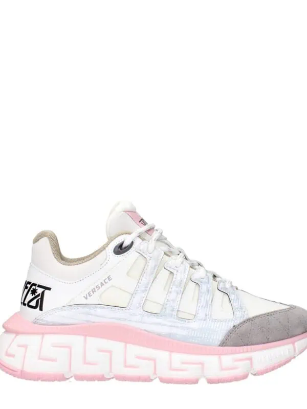 White and pink Versace chunky sneakers with unique design elements and branding details for a luxury streetwear look.