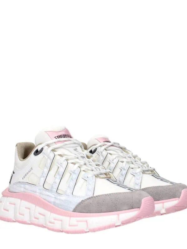 Versace Chain Reaction Sneakers with white, pink, and grey accents, featuring a chunky sole and designer logo detailing for a luxury streetwear look.