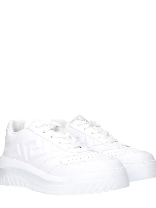 White luxury designer sneakers with a chunky sole and subtle branding, perfect for stylish casual wear.