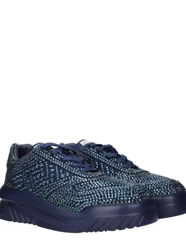 Glittering navy blue sneakers adorned with sparkling rhinestones, featuring a chunky sole and stylish laces, perfect for making a bold fashion statement.