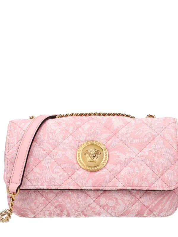 Pink quilted designer handbag with gold Medusa emblem and chain strap, stylish accessory for women.