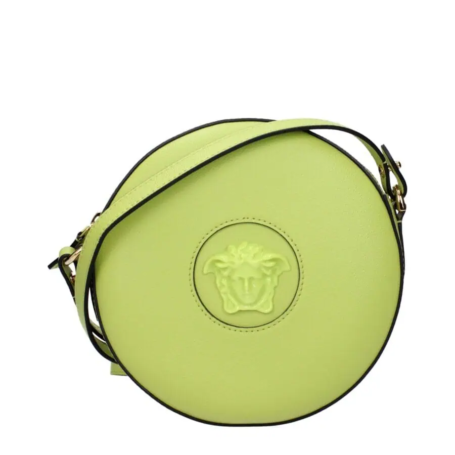 Vivid lime green round designer shoulder bag with Medusa logo embossed on the front, featuring black piping and gold hardware, perfect for a stylish statement accessory.