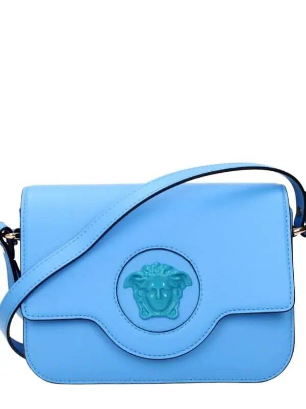 Light blue designer shoulder bag with a Medusa emblem, made of high-quality leather, perfect for stylish everyday use and fashion-forward accessories.