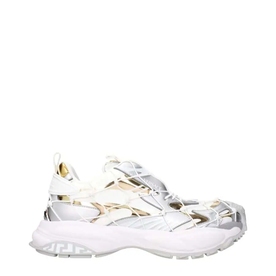 White and gold Versace luxury sneakers with intricate design and bold branding for high-end fashion statement.
