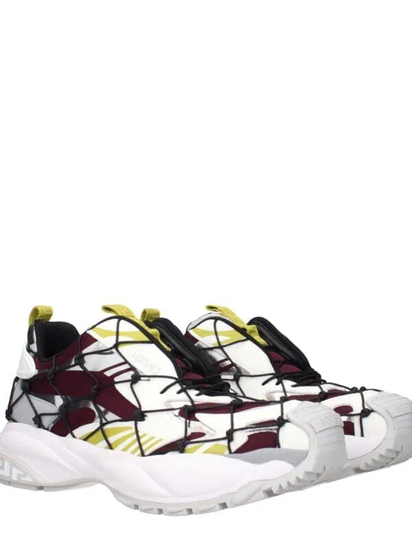 Bold designer sneakers with a striking logo, multicolor pattern, and chunky sole, crafted by Versace for luxury streetwear style.