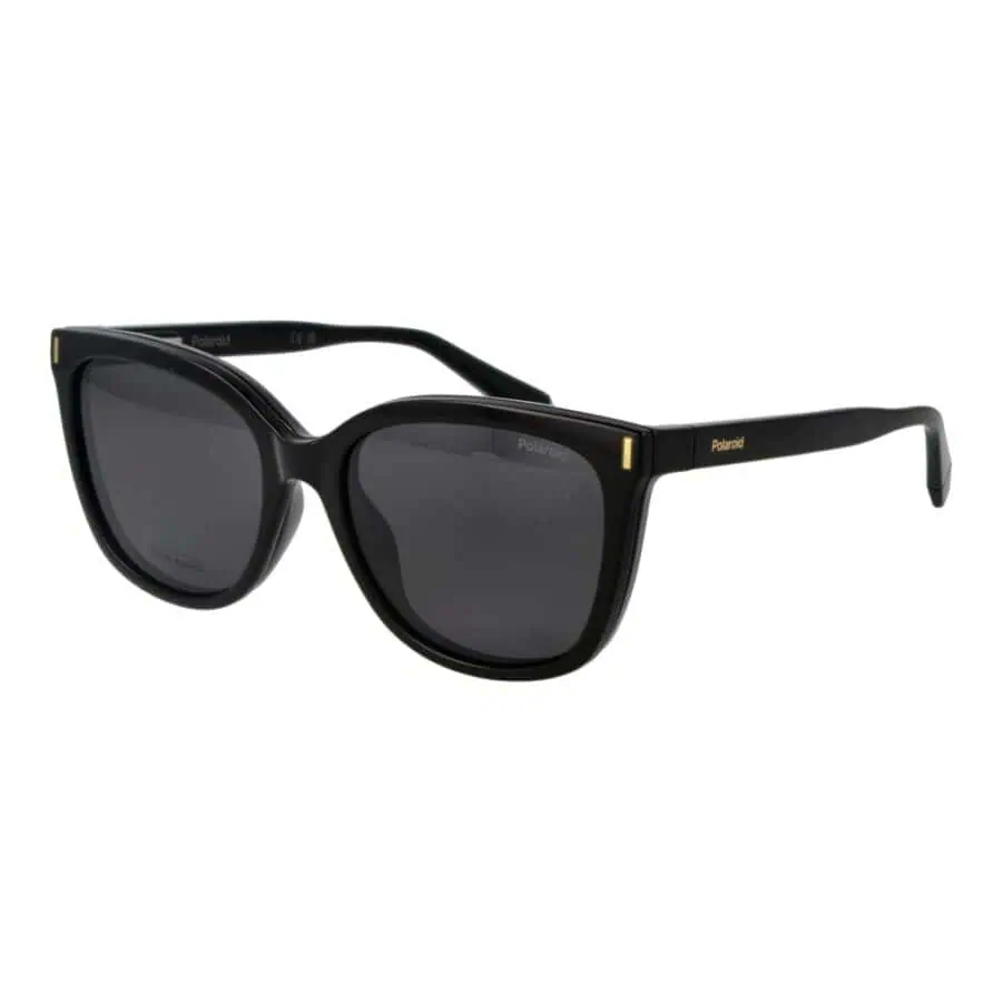 Black oversized sunglasses with UV protection and stylish gold details, perfect for a chic, fashionable look.
