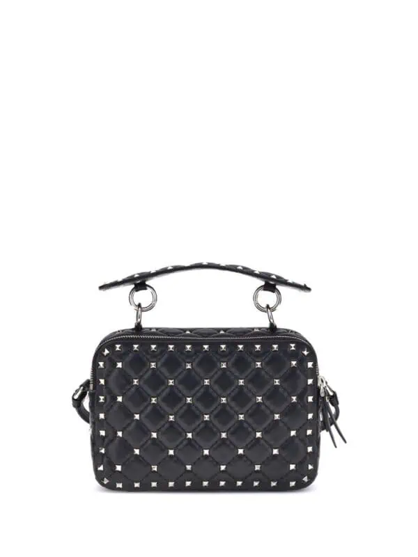 Black quilted leather handbag with silver stud accents and adjustable strap, designed by Lux Brands.