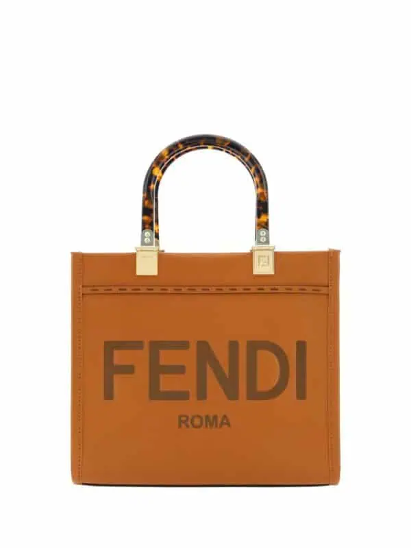 Tote bag with the Fendi logo, featuring tortoiseshell handles and a tan leather exterior, stylish and versatile accessory for luxury fashion statements.
