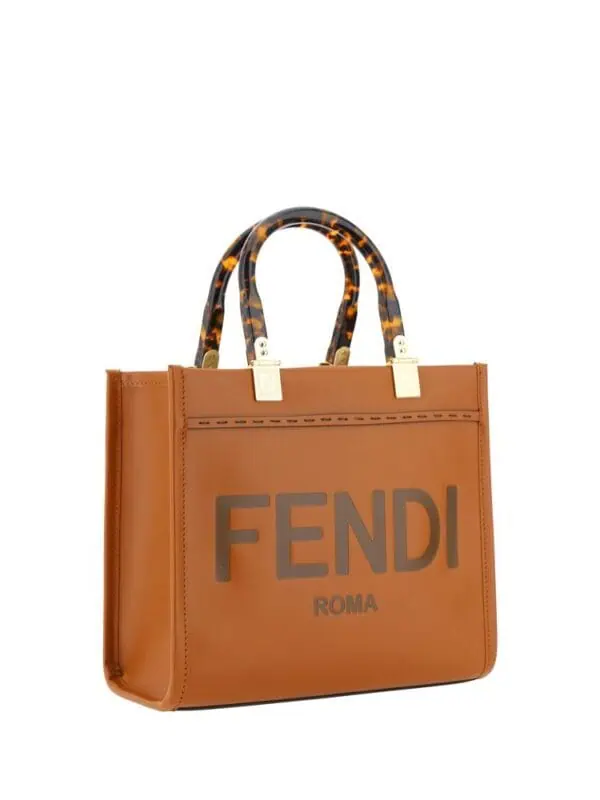 Tortoiseshell handle Fendi tote bag with large logo print and brown leather finish.