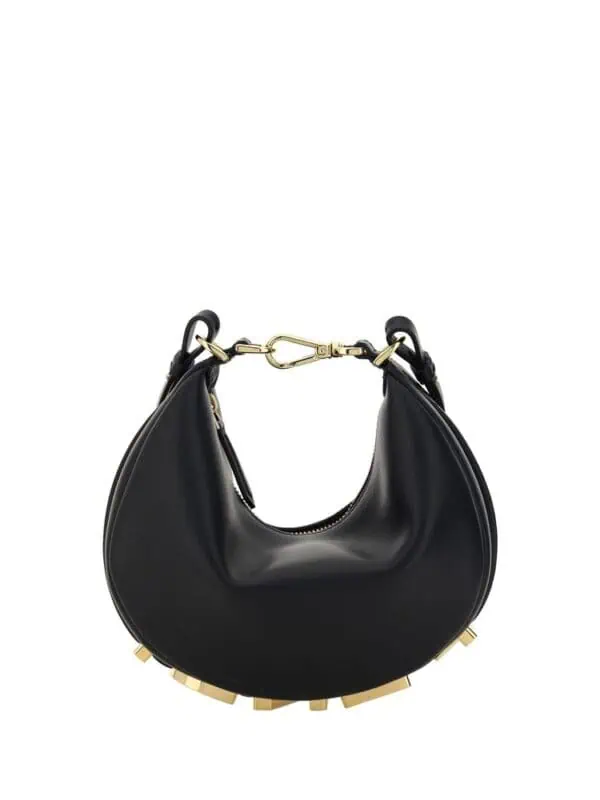 Luxurious black crescent-shaped handbag with gold-tone hardware, modern design, perfect for stylish occasions. Leather material with studded base adds a trendy touch to any outfit.